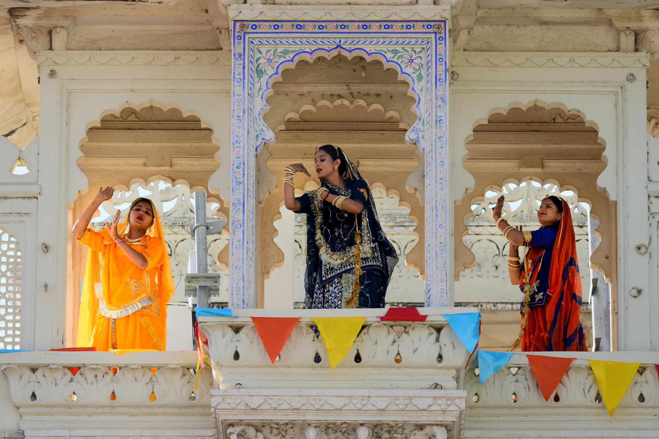 Dancers in traditional sari dresses at Udaipur City Palace, India